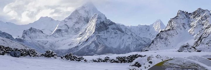 The delivered photo: a snowy mountain camp